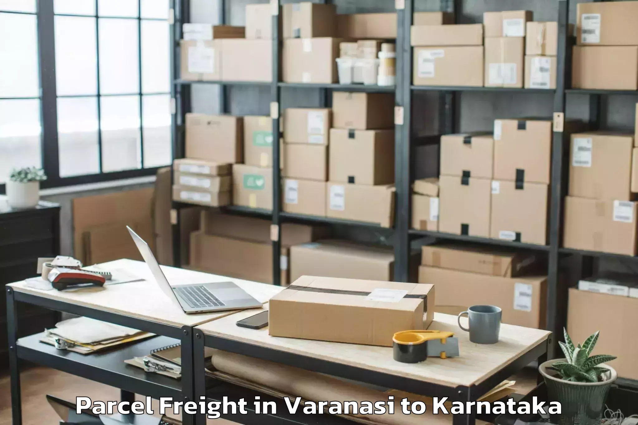 Leading Varanasi to Karnataka State Rural Developm Parcel Freight Provider